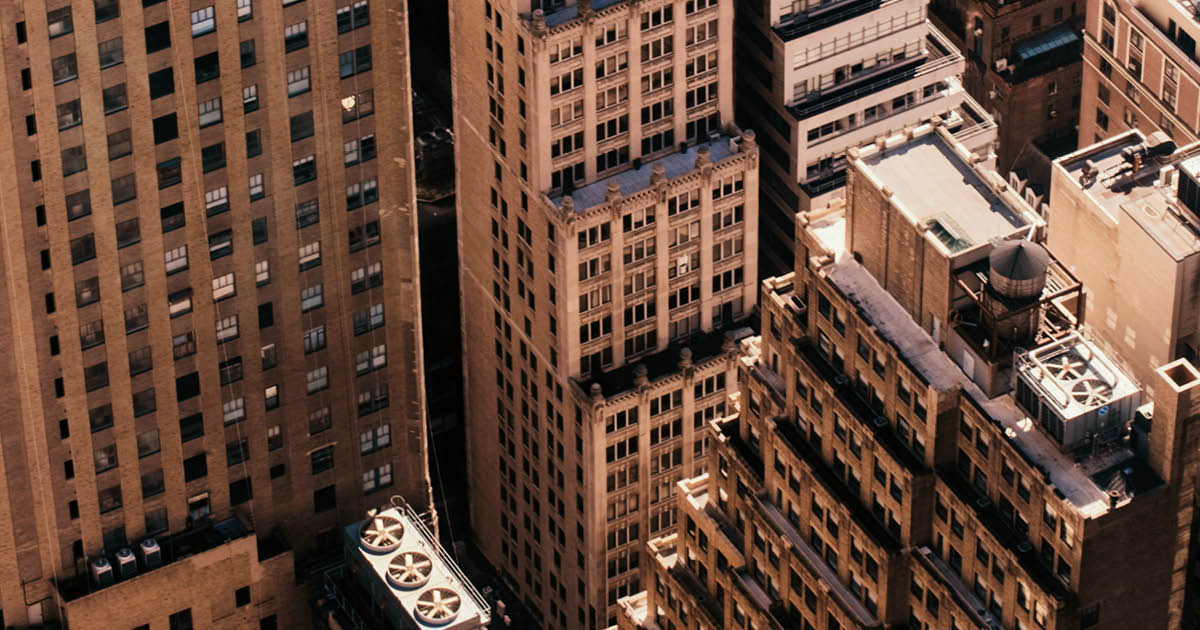 Best innovation in AI for operational automation & industry intelligence Image of New York City buildings in gold tone