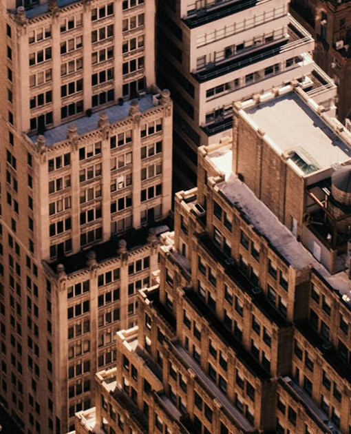 Image of New York City buildings in gold tone