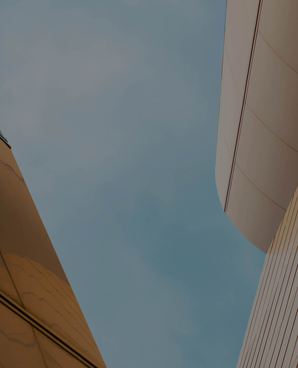 Cover image for Avaloq wealth insights 2026, showing abstract architectural skyscraper facades in blue and bronze tones with the report title and year displayed prominently.