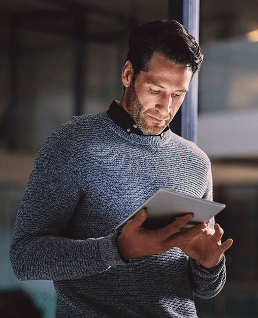 The case for crypto services in wealth management Person using a tablet in a modern office